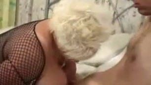 Sexy blonde BBW in fishnet fucked