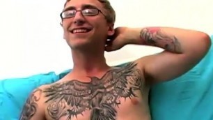 Geeky amateur with glasses and tattoos strokes his big cock