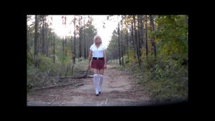 School girl walk out in the woods