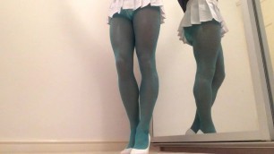 White pleated skirt and blue pantyhose .